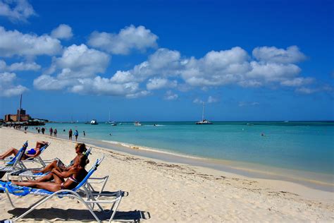 Topless sunbathing on palm beach in Aruba 2021